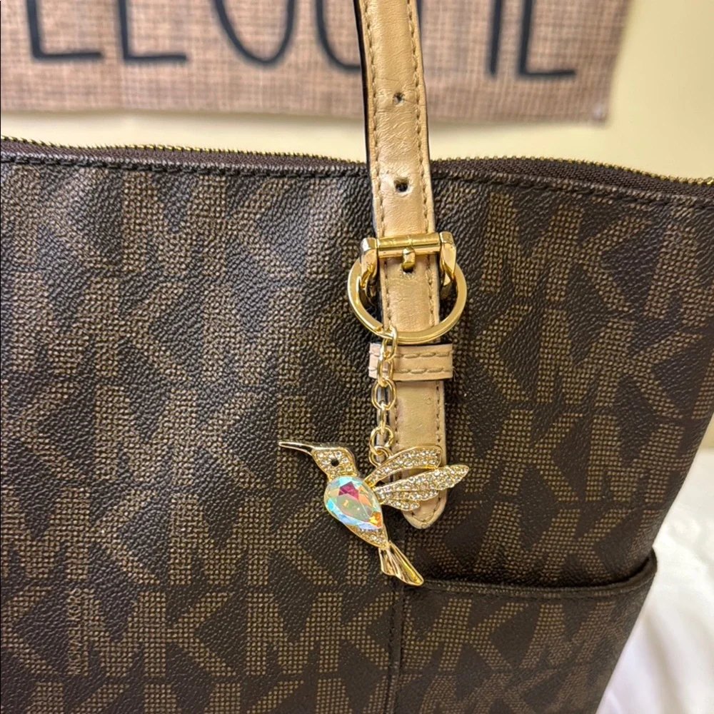 Michael Kors Jet‎ Set Travel Tote w/ Hummingbird Charm – Brown MK Monogram